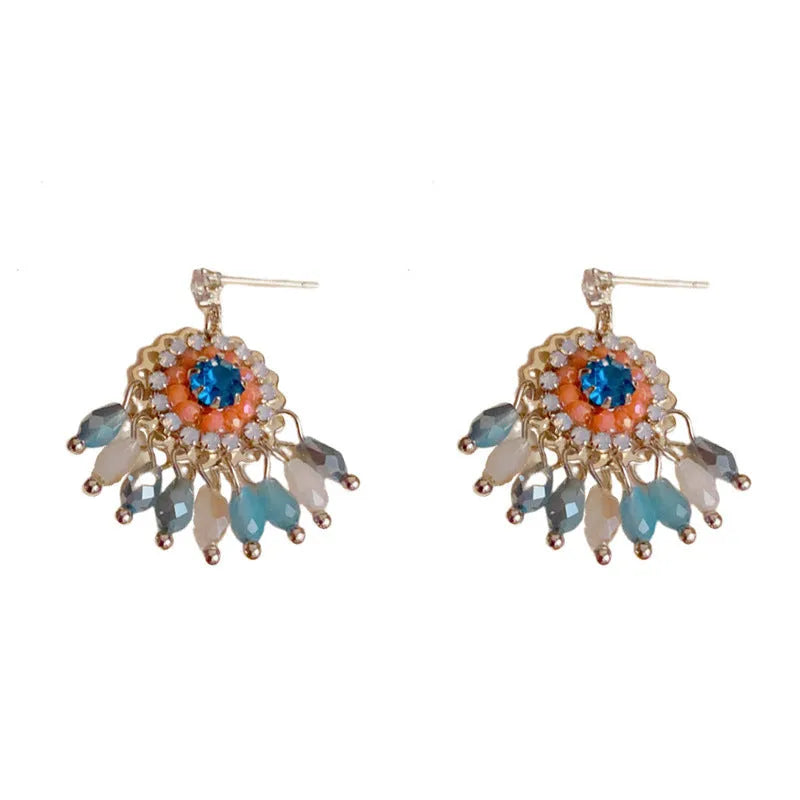 Round crystal tassel earrings with diamond embedded design in thick gold plated copper