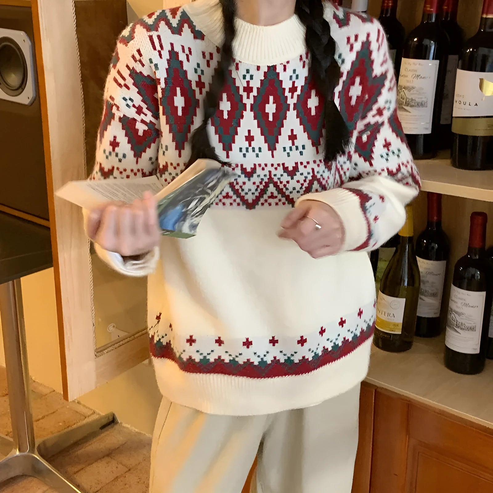Red and white striped loose retro pullover knitted top on a hanger.