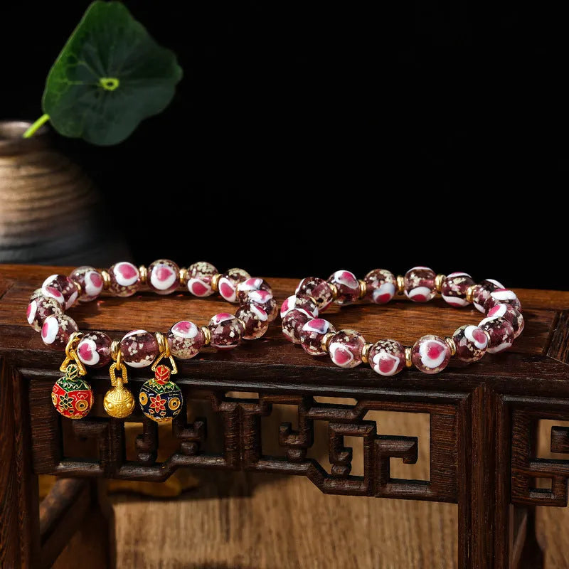 Handmade heart-shaped glass bracelet with swallowing gold beast pattern in ancient fluorescent glaze