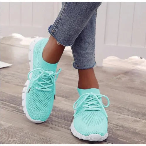 Women's high-top breathable sneaker in multiple colours on a white background, showing lace-up front and flat rubber sole.