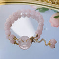 Pink crystal peace buckle bracelet with safety clasp on silver-coloured chain
