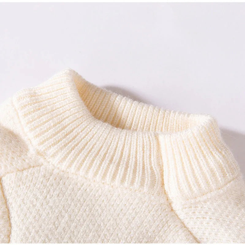 White knitted small dog sweater with rainbow Apple embroidery and green smiley face on a pet