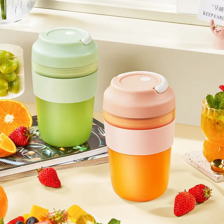 Portable 400ml blender juicer cup with four stainless steel blades in purple, green, or orange colours