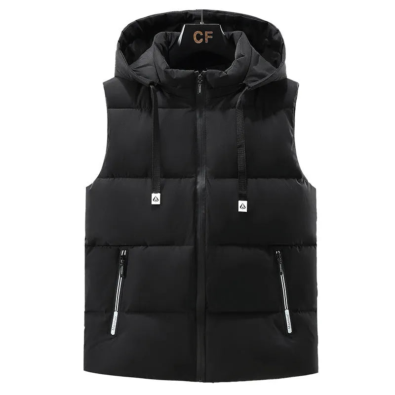 Man wearing a solid blue thickened vest with a removable hood and slant pockets.
