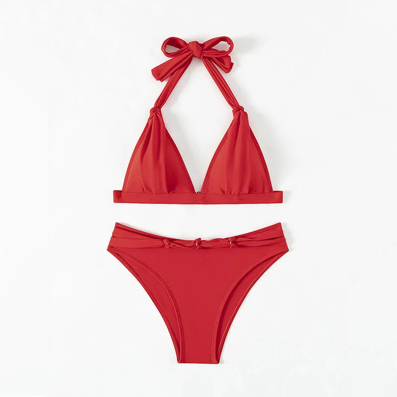 Red women's lace-up halterneck bikini top with matching split shorts.