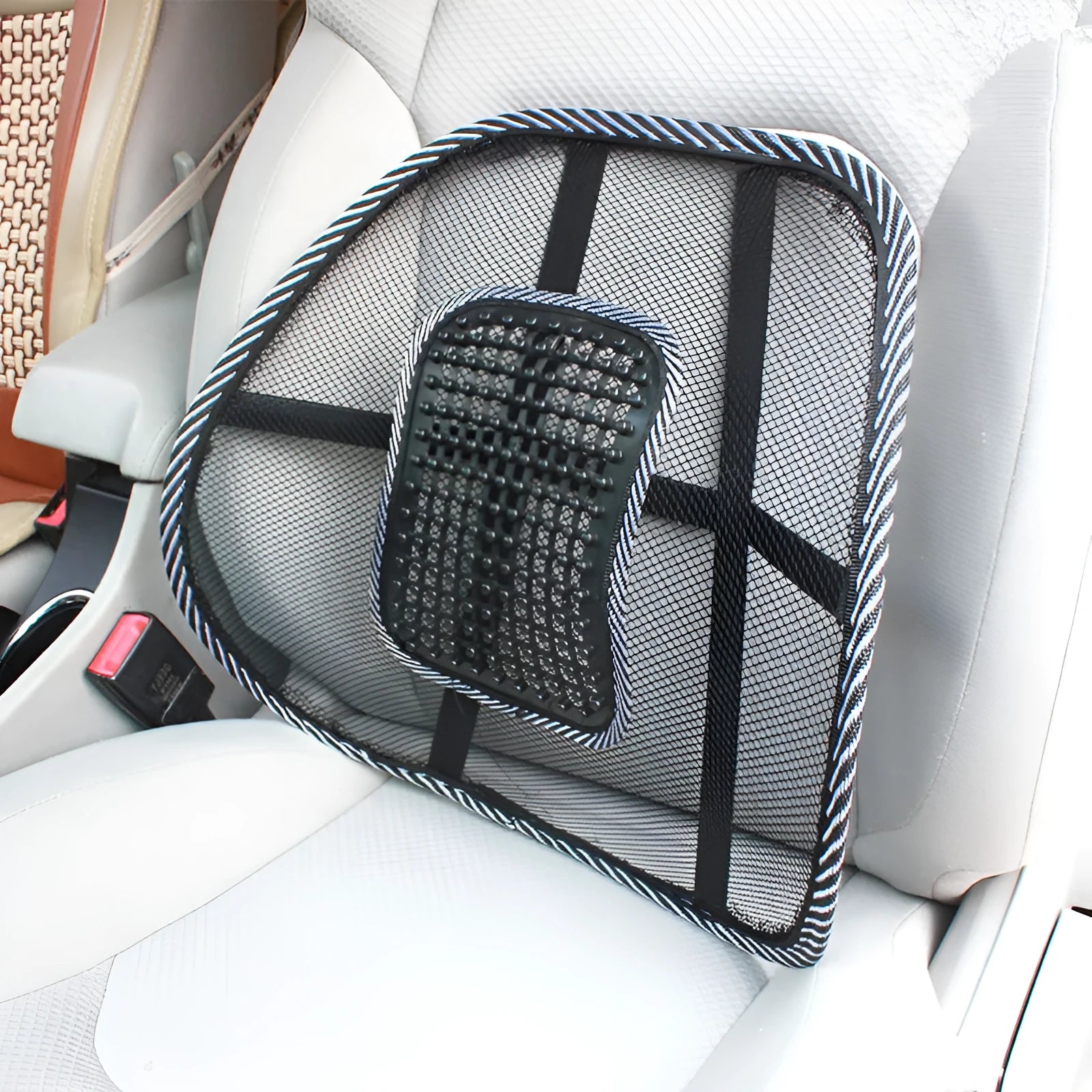 Black leather-look car lumbar support pillow with mesh panel and adjustable straps