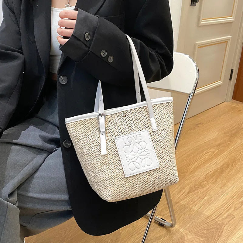 Women's woven straw shoulder bag with European retro style showing large opening and three-dimensional pockets