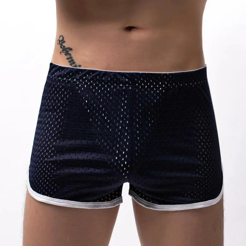 Men's three-point boxers in a cotton and nylon blend, shown in black, on a mid-waist fit model.