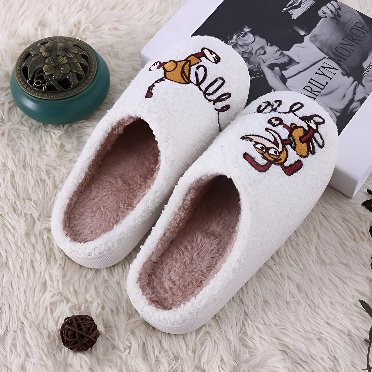 White fluffy slippers with cartoon patterns, rubber soles, and toe holder design