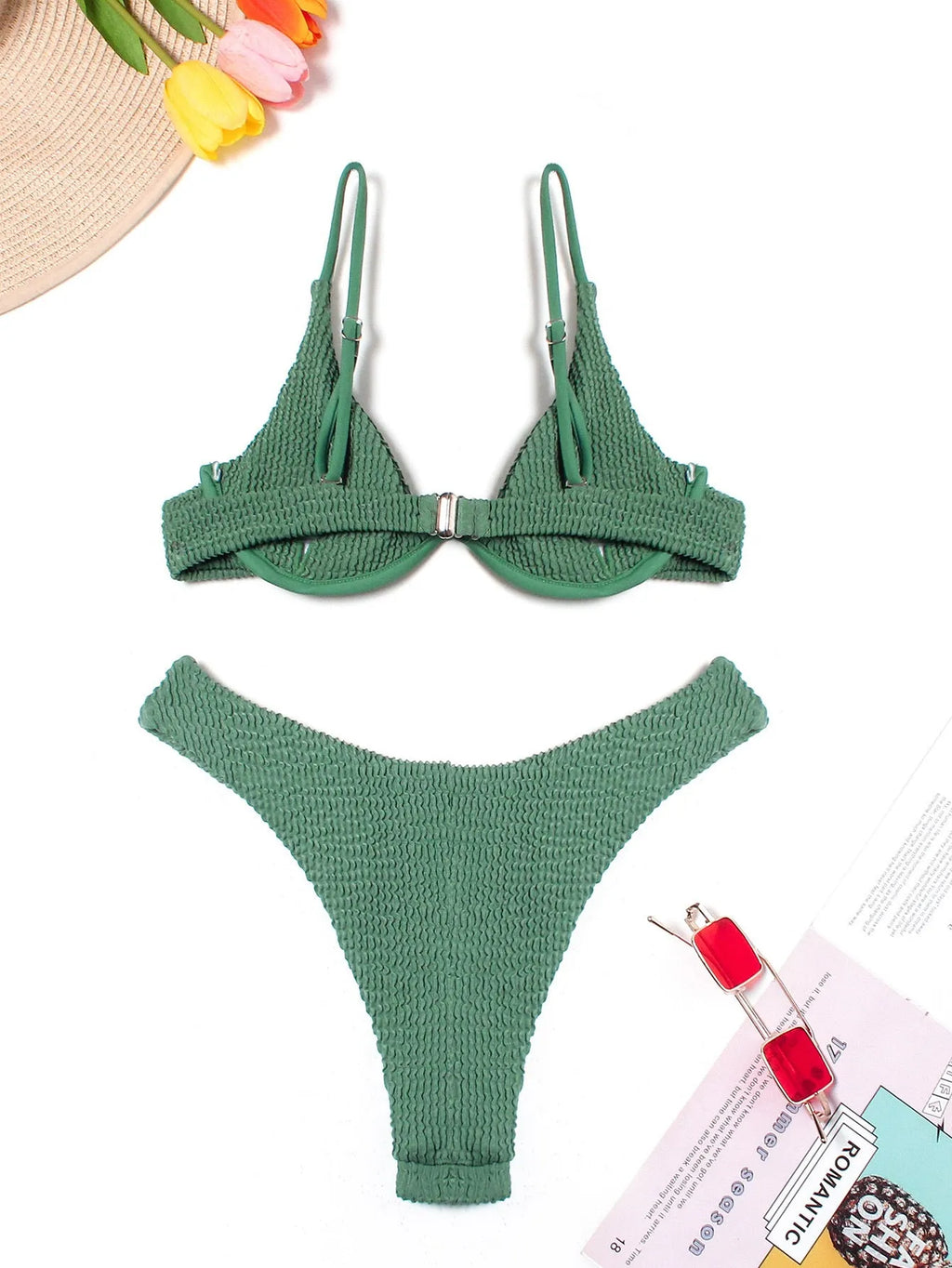 Green women's bikini set with ruffle trim, showing top and split briefs made from quick-dry polyester fabric.
