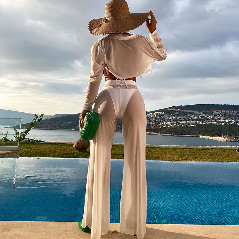 Women's white swimsuit four-piece set showing high-waist trousers and backless top