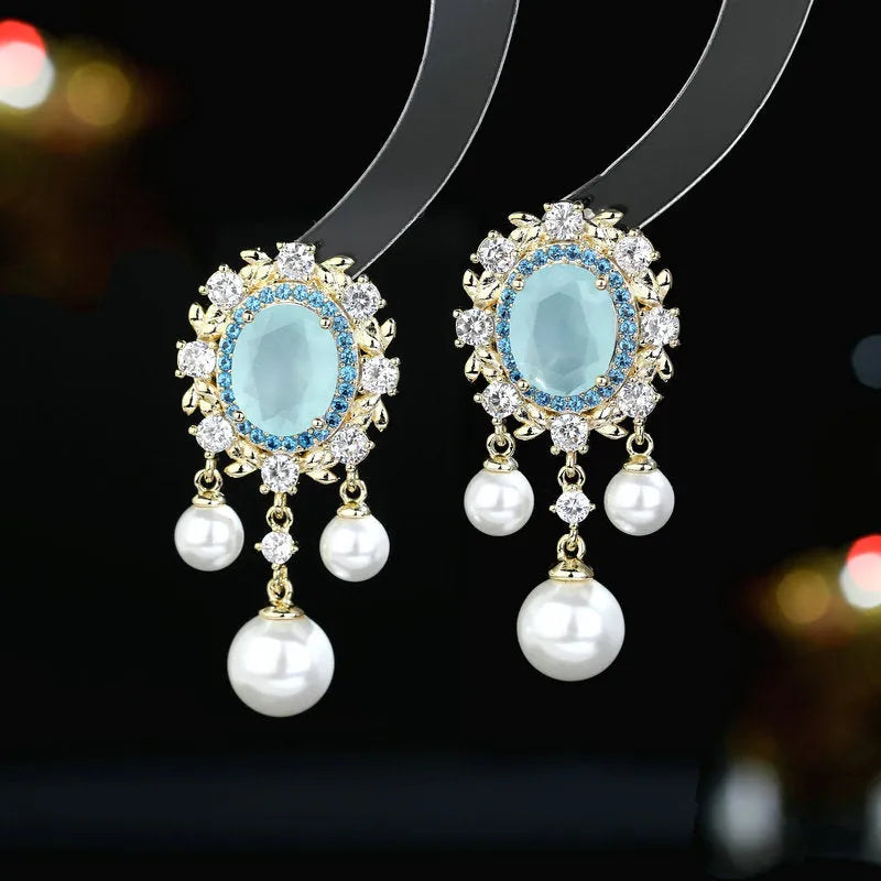 Oval geometric copper earrings with inlaid zircon crystals and pearl tassels in light purple colour