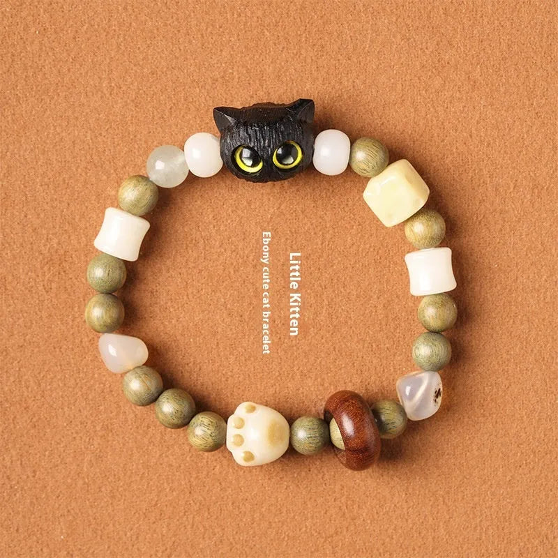 Hand-woven beaded bracelet with a cat's paw charm, jade, and wood beads in a cartoon style.
