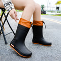 Women's non-slip PVC rain boots in apricot, black, brown, and pink waterproof mouth colours