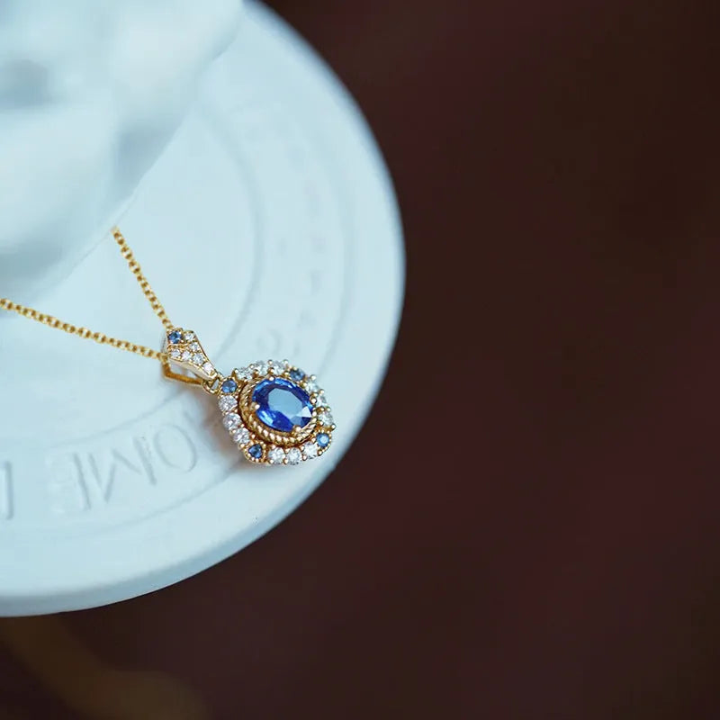 Women's adjustable royal necklace with mixed gem and zircon pendant on a copper box chain.