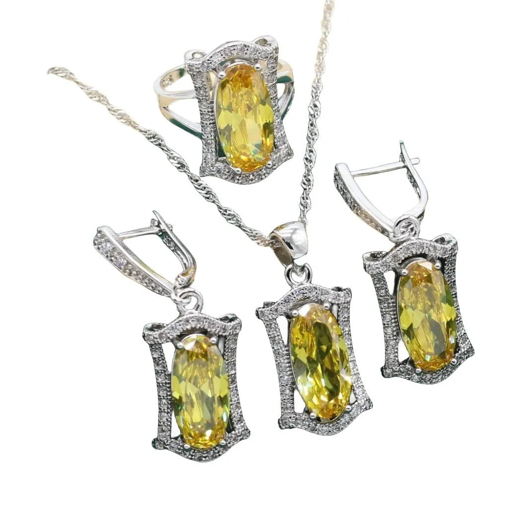 Yellow anti-allergy zircon jewellery set with snake bone chain necklace, earrings, ring, and bracelet on display.
