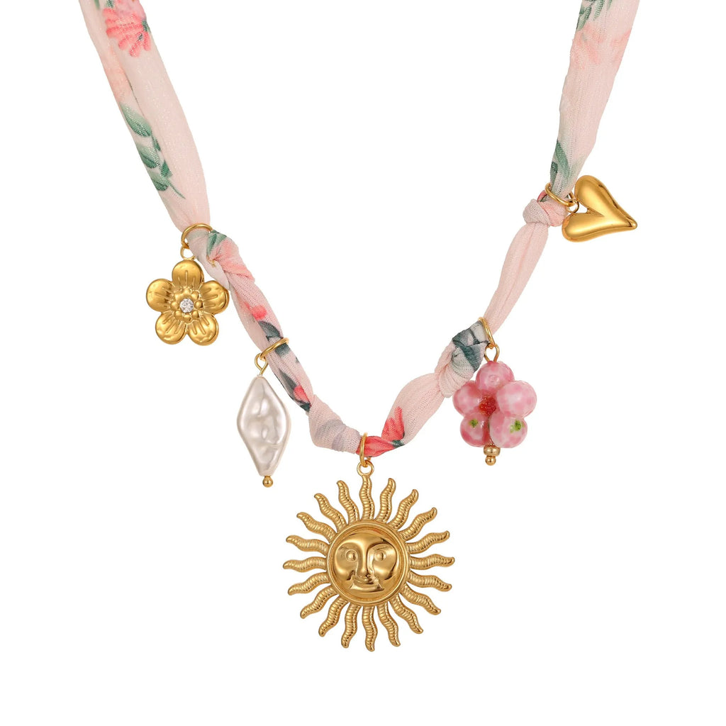 Geometric sun pendant necklace on stainless steel chain with 18K gold electroplated finish