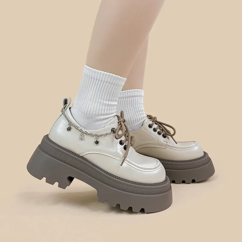 White women's platform leather shoes with lace-up front and a thick chunky heel.