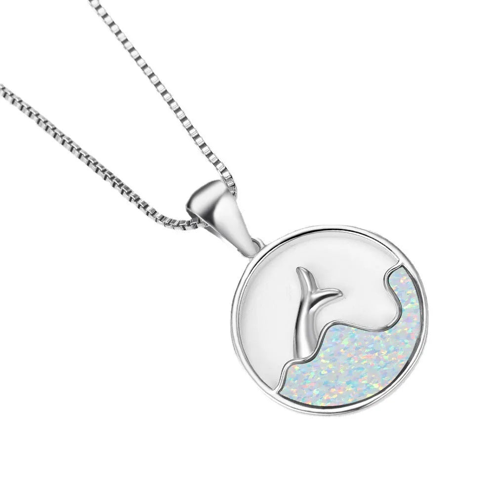 Geometric fishtail pendant necklace with round elements in platinum blue opal colour