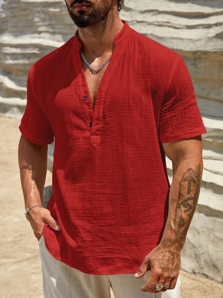 Man wearing a light blue stand collar short-sleeved casual shirt for summer.