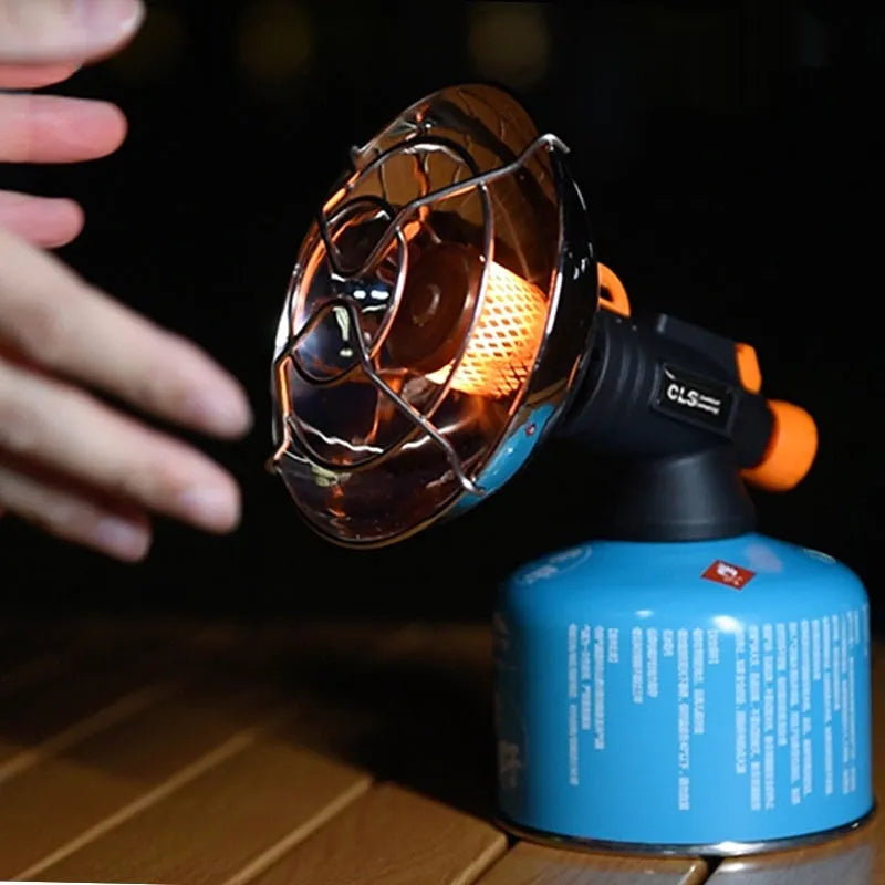 Black and orange portable outdoor heater stove with automatic ignition for camping.