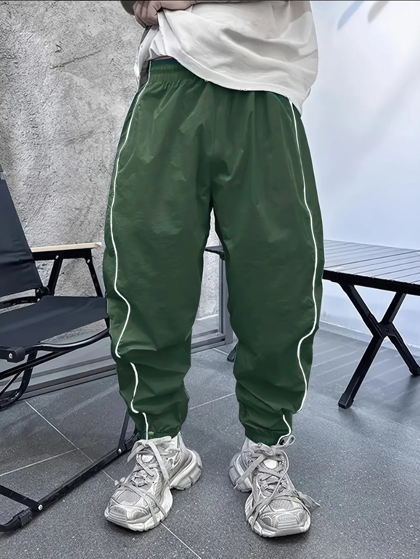 Men's loose fit bamboo fibre cropped sports trousers in Army Green colour.