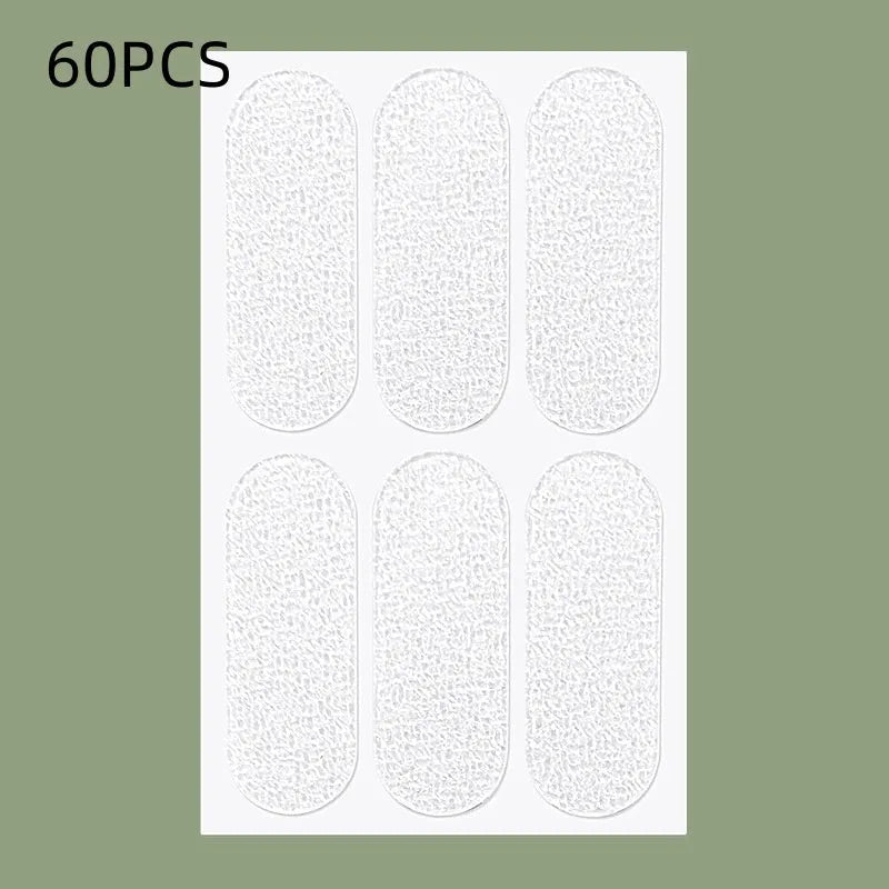 Close-up of transparent and frosted TPU ear patches on backing paper, showing 0.1cm thickness.
