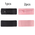 Black fitness training belt with auxiliary strap for weight-bearing hip bridge exercises