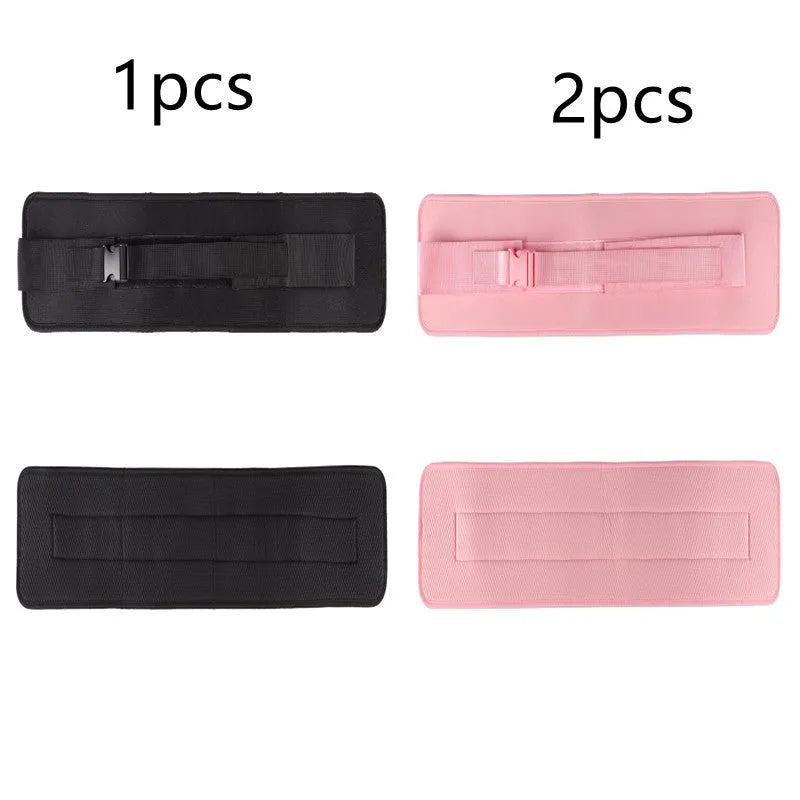 Black fitness training belt with auxiliary strap for weight-bearing hip bridge exercises