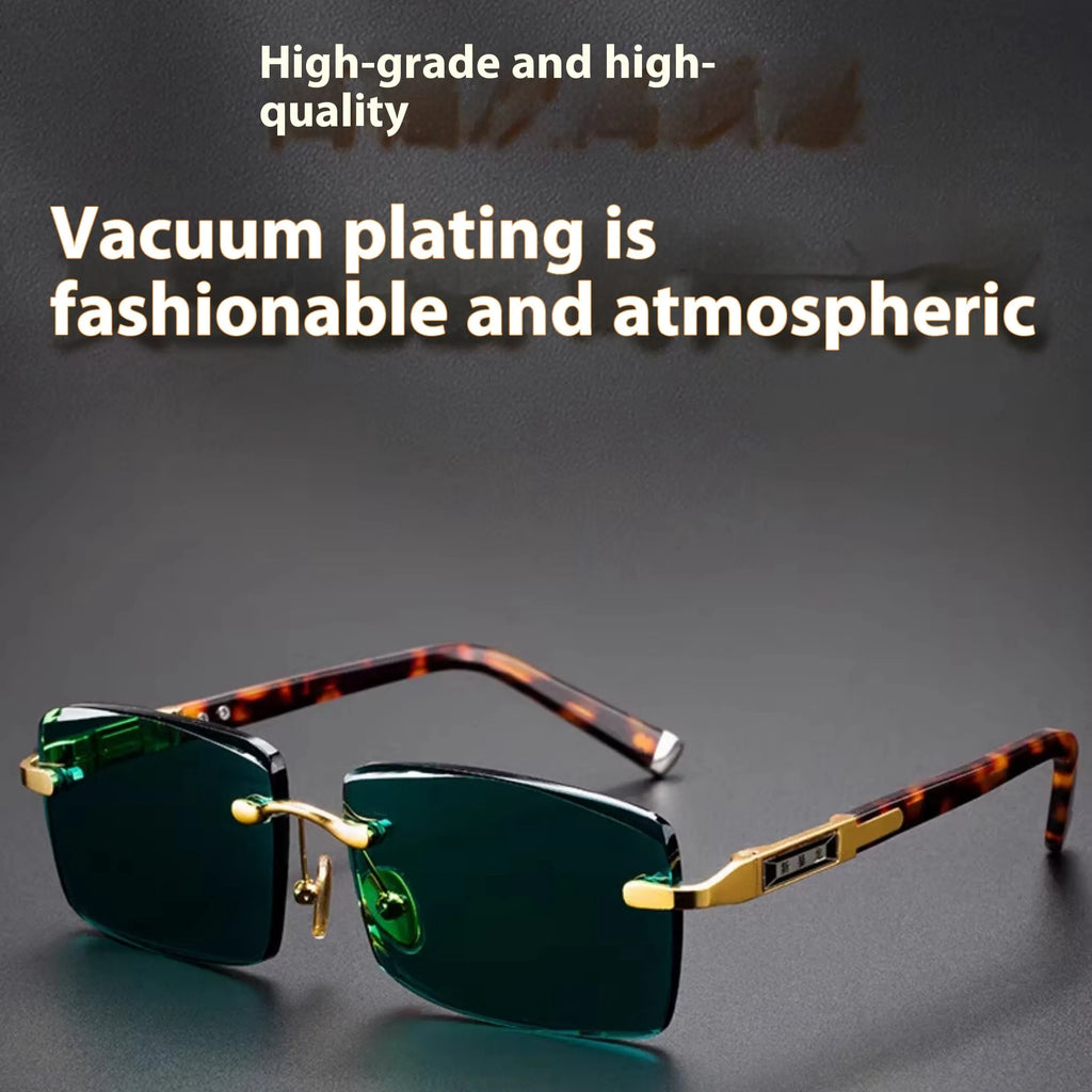 Dark green frameless crystal sunglasses with a hard case and cleaning cloth on a plain background.