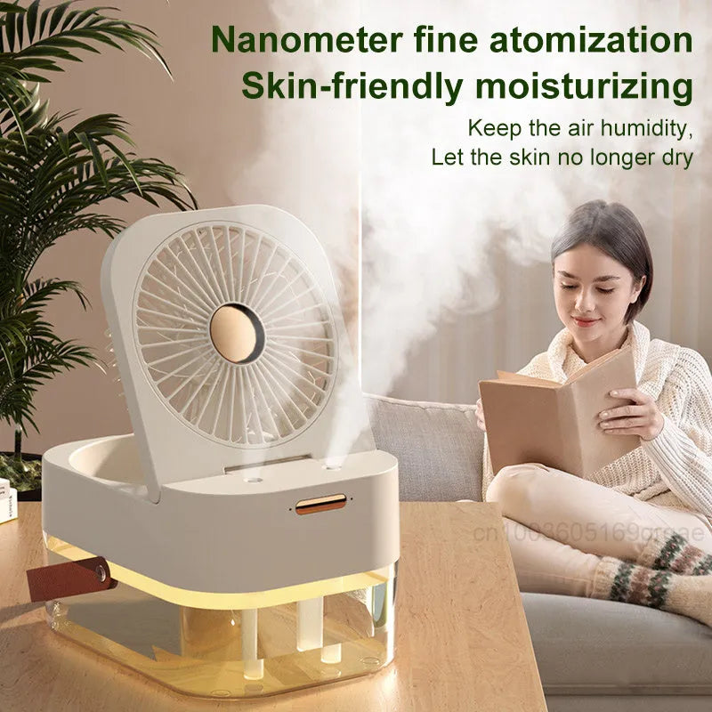 Pearl white portable USB desk fan with humidifier mist and soft night light on a wooden desk.