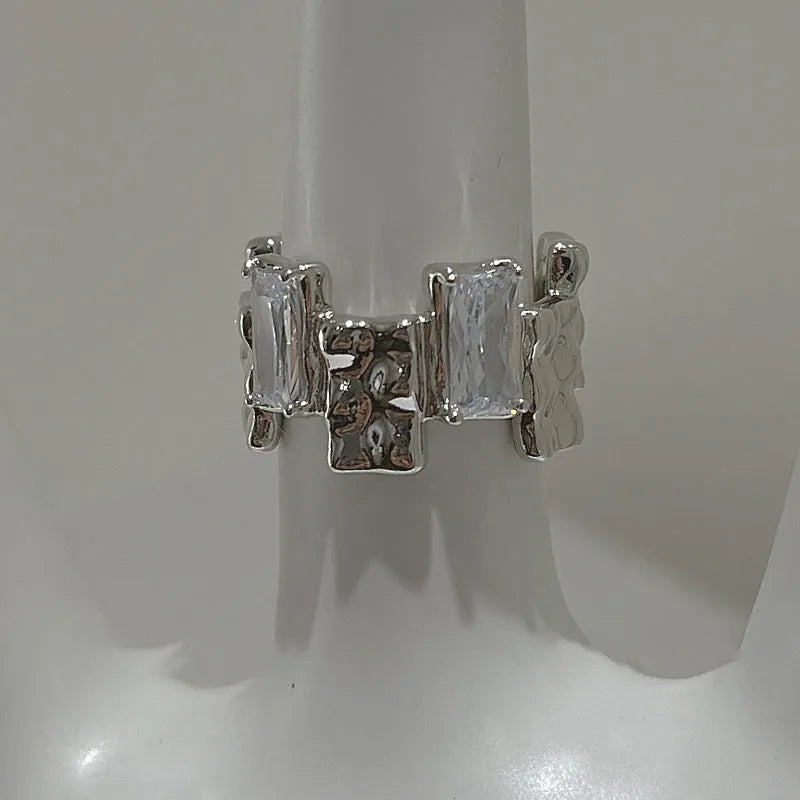 Silver geometric open ring with zircon stone setting and three-dimensional decoration