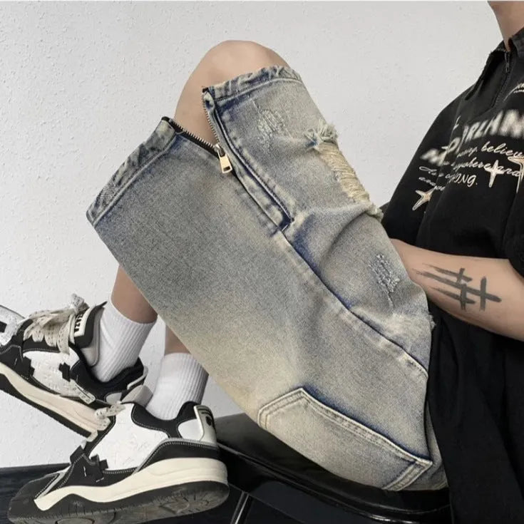 Blue retro tattered denim shorts with a wide leg loose fit on a person