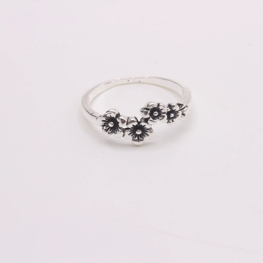 Antique silver alloy geometric ring with retro personality style on white background
