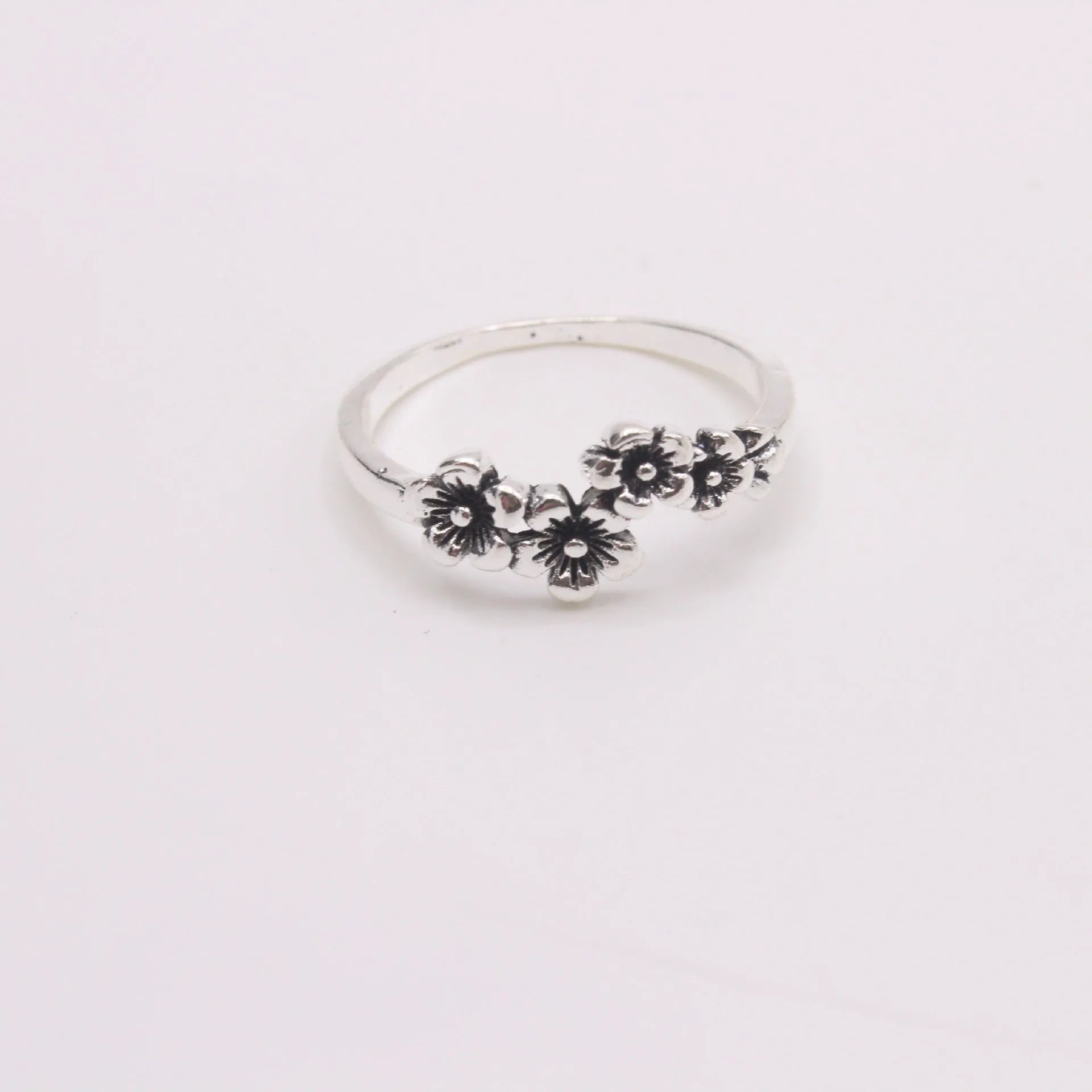 Antique silver alloy geometric ring with retro personality style on white background