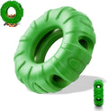 Blue rubber tyre-shaped dog chew toy with oval openings, shown as a slow feeder and interactive puzzle toy