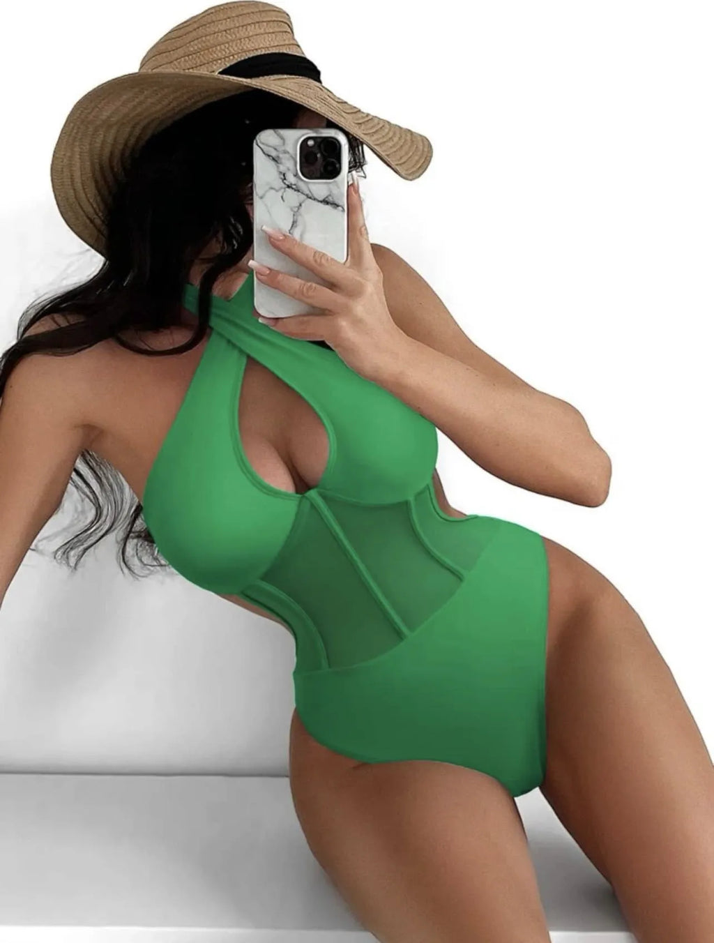 Black one-piece bikini swimsuit for women on a mannequin, showing the front design.