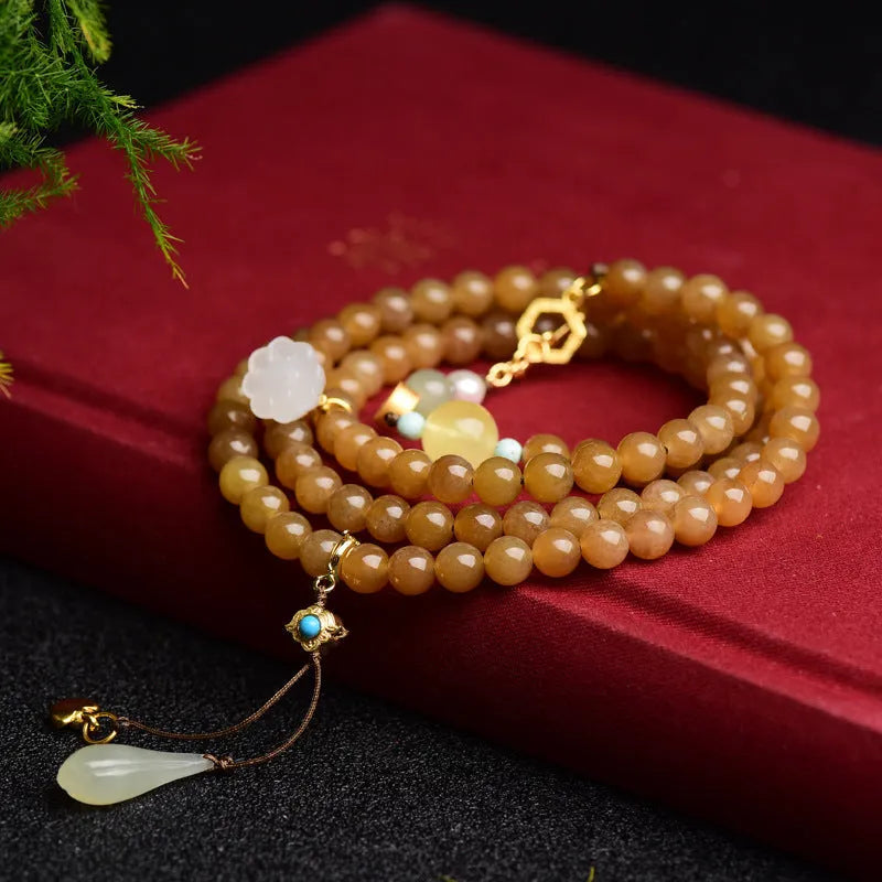 Jade beaded bracelet with green pine 6mm round beads, leaf charms, and beeswax accents