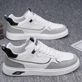 Men's Korean-style canvas board shoes in black with leather stitching details and mesh lining