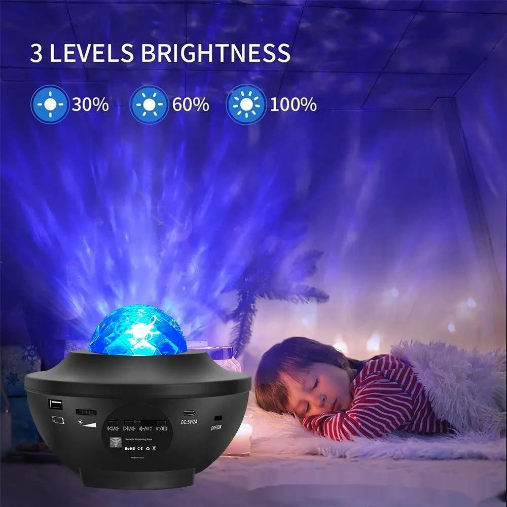 Small black bowl-shaped starry sky projection lamp with rotating water ripple laser effects on desk