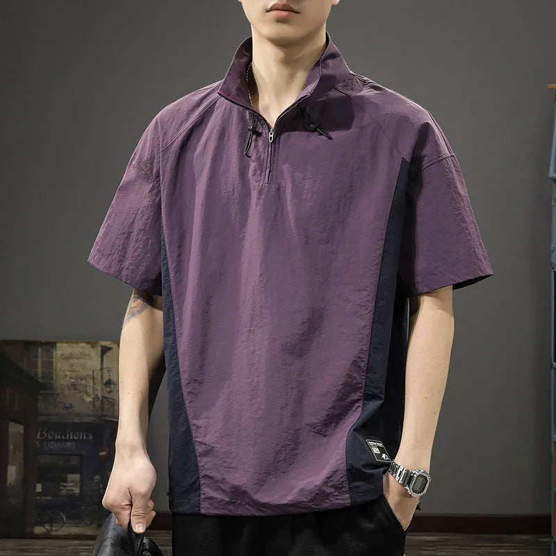 Man modelling a brown half-zip stand collar casual shirt with short sleeves.