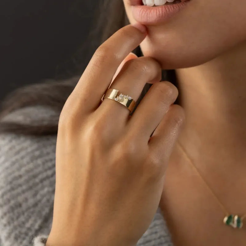 Gold electroplated copper women's ring with zircon stones showing UK size markings 6-10