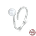 Adjustable shell pearl ring in S925 sterling silver with open-loop design
