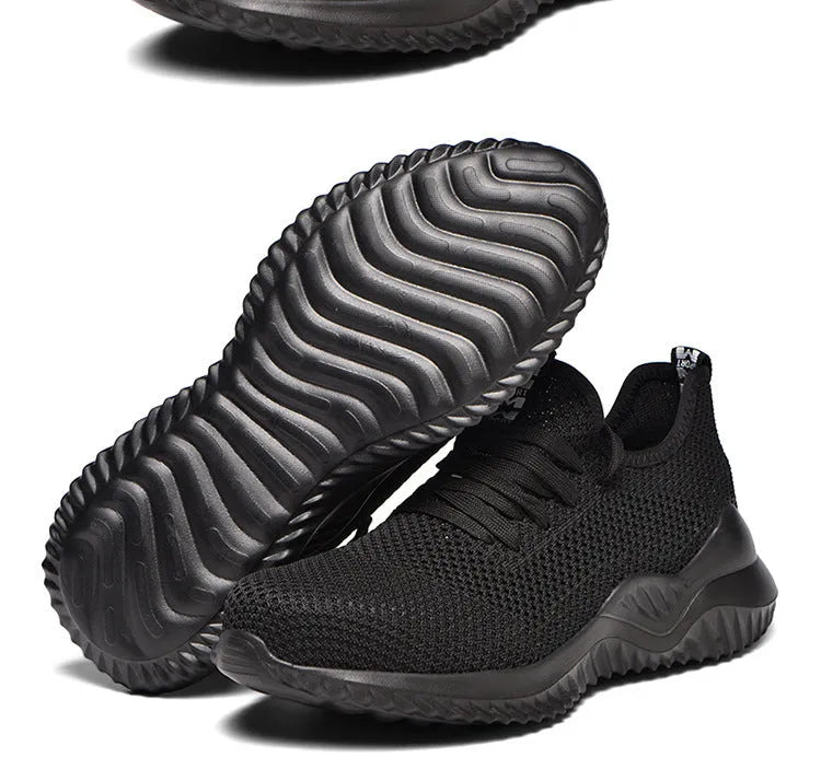 Black anti-static steel toe cap safety shoes with a low-cut EVA construction.
