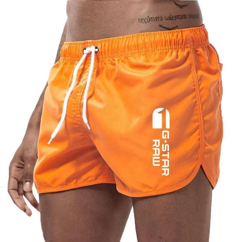 Men's thin hemp-blended polyester sport shorts in multiple colours on a mannequin, showing elastic waistband.