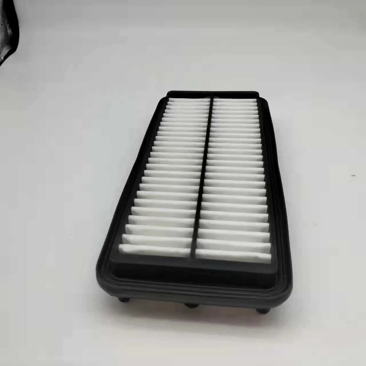 Black rectangular car panel air filter with dimensions 256mm by 113mm by 40mm