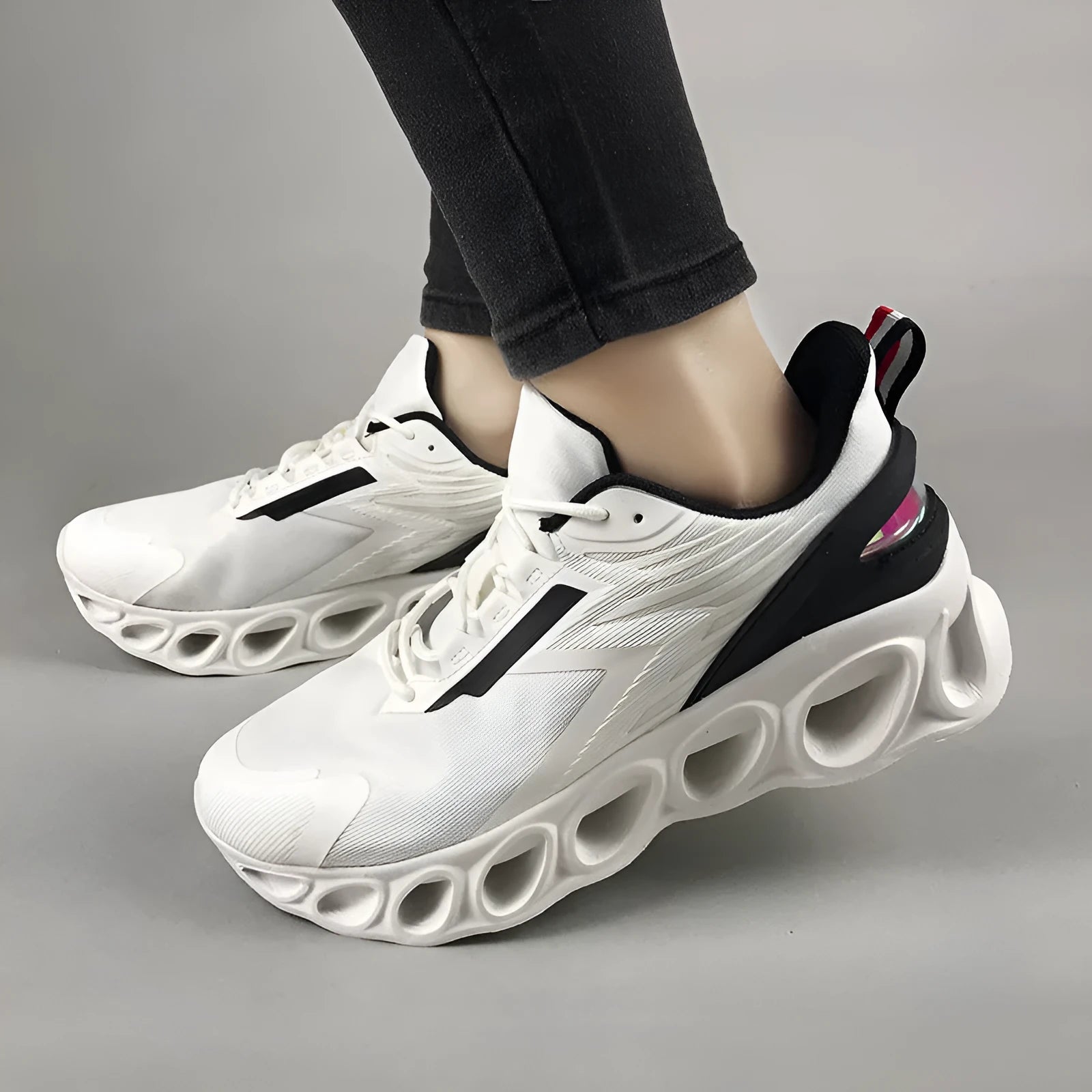 Black breathable low-top casual sports shoes with mesh upper and white stitching on a flat EVA sole.