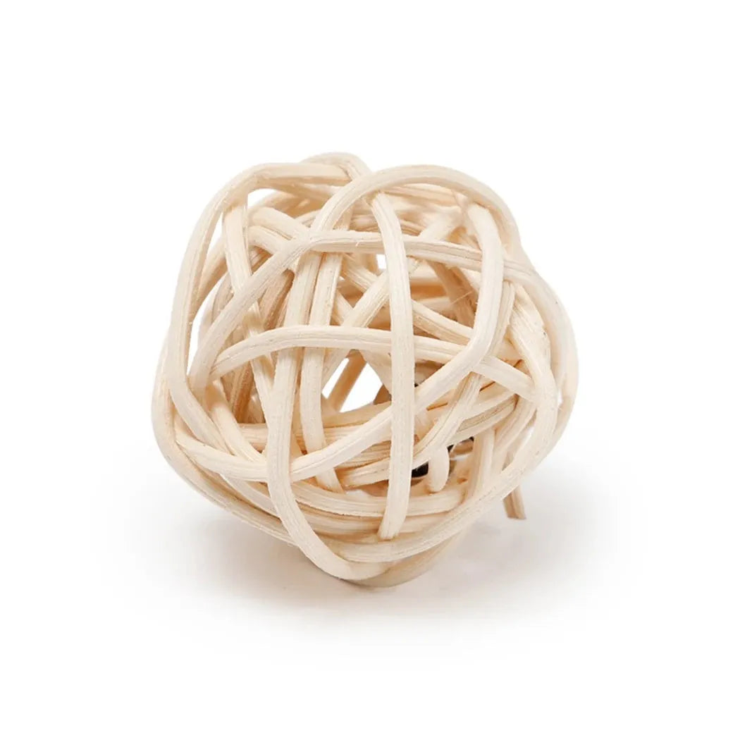 Two cat toys: a brown woven rattan ball and a multicoloured faux feather ball with a bell on a white background.