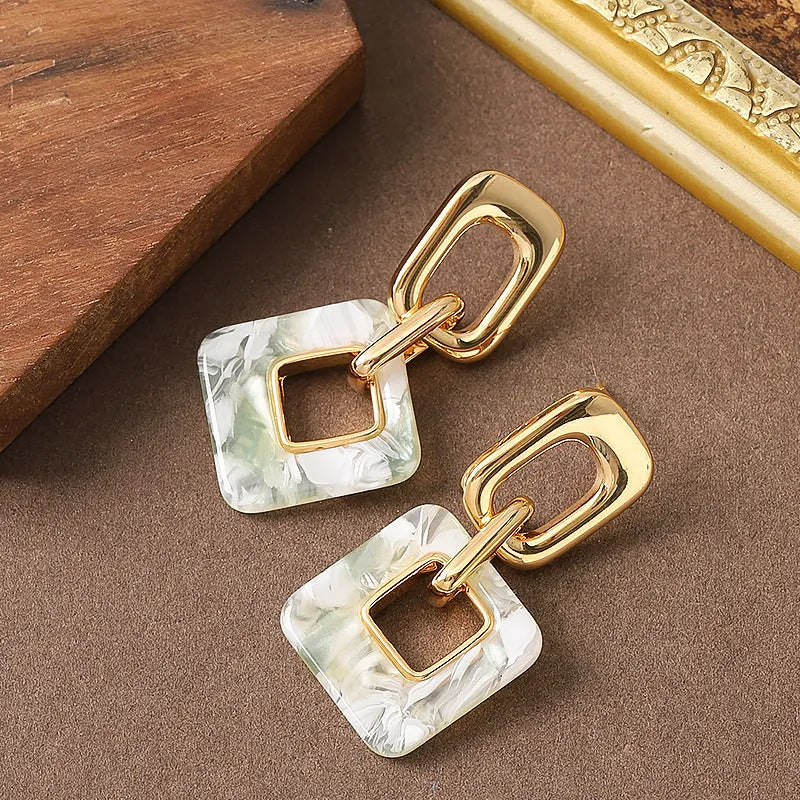 Copper hollow geometric square earrings with chamfered corners in gold or blue electroplated finish