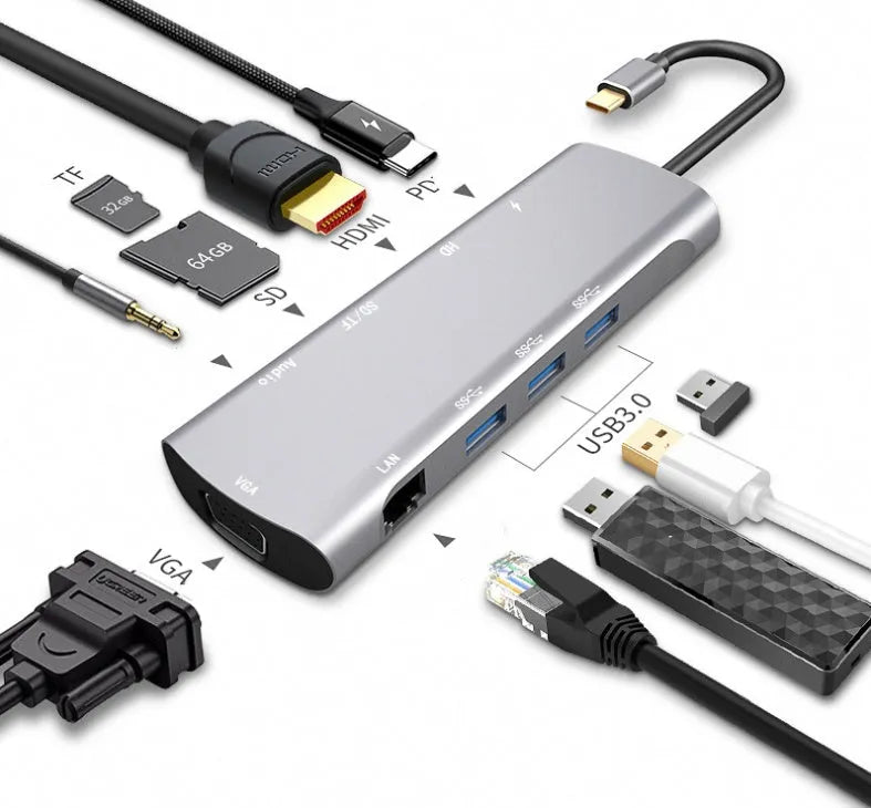 Grey aluminium USB-C docking station showing HDMI, VGA, USB, and charging ports.